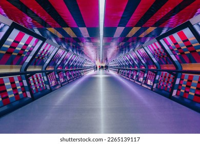 Colourful, geometric and symmetrical tunnel, light rainbow abstract architecture and design