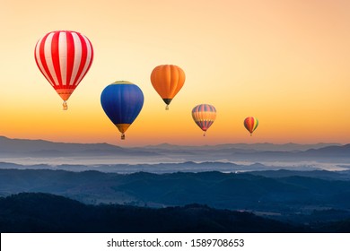 Colourful hot air balloons flying over the mountain - Shutterstock ID 1589708653