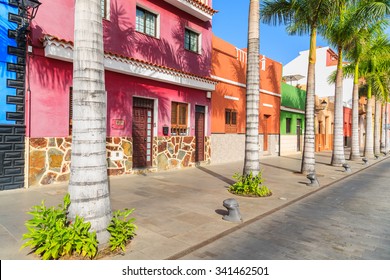 Colourful Houses And Palm Trees On Street In Puerto De La Cruz Town, Tenerife, Canary Islands, Spain