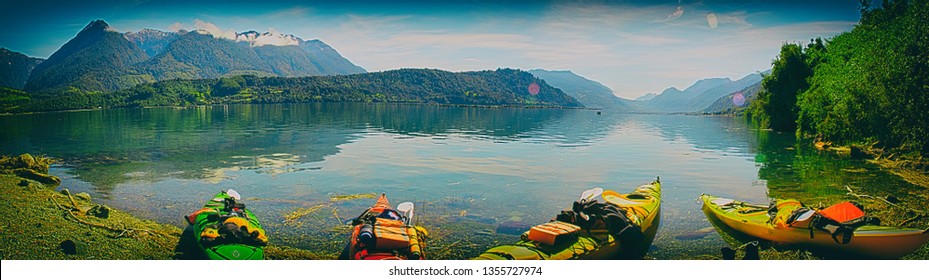 Colourful kayaks on the Chilean fjords riverside. - Shutterstock ID 1355727974