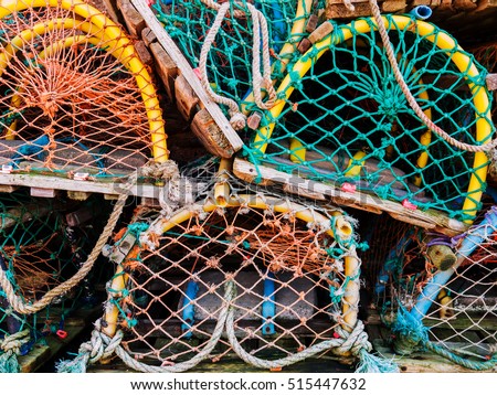 Colourful Lobster pots stucked on each other in a Scottish Fishing village.  Crail, Fife, Scotland, UK