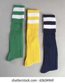 Colourful Pairs Of Soccer Socks Isolated On Plain Background