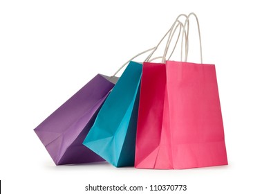 Colourful paper shopping bags isolated on white - Shutterstock ID 110370773