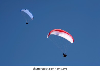 colourful parachutes in the blue sky