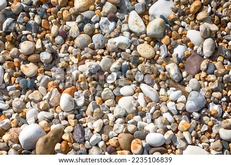 Colourful Pebbles in a Beach. HDR.