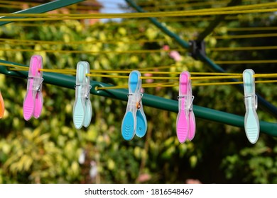 Colourful Pegs On Washing Line In Sunshine