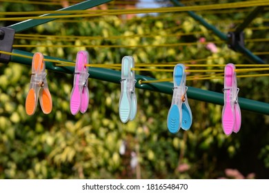 Colourful Pegs On Washing Line In Sunshine