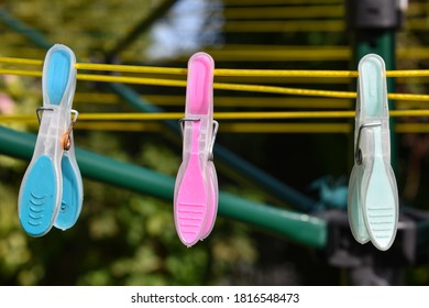 Colourful Pegs On Washing Line In Sunshine