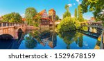 A colourful and picturesque view of the half-timbered old houses on the banks of the Pegnitz river in Nuremberg. Tourist attractions in Bavaria and Germany