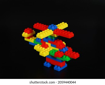 Colourful Random Block Brick Lego Aeroplane For Kid With Black Isolated Background