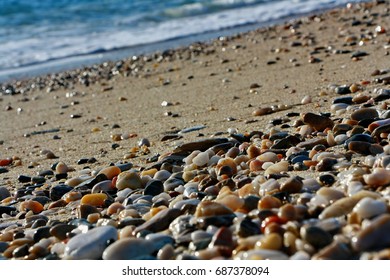 Colourful round pebbles on the beach; close-up of stones on coastline; island of Thassos in Greece - Shutterstock ID 687378094