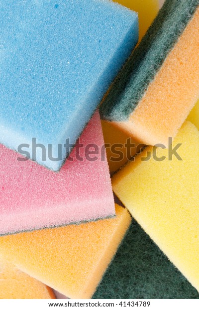 Colourful sponges isolated\
on a white bg