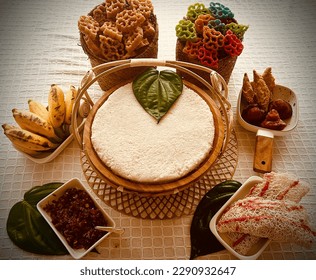 Colourful Sweet table with Srilankan traditional sweets and decorated with oil lamp and betel leaves for Sinhala and Tamil New Year in Sri Lanka 