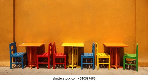 Colourful table & chairs ready for a street cafe or restaurant, Cartagena, Colombia. 
