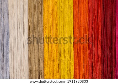 Colourful threads of wool background texture