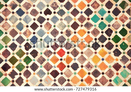Colourful tiles in the Moorish palace of Alhambra, Granada, Spain