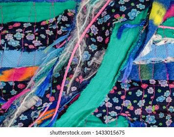 Colourful Torn Fabric Strips, Cords And Wool, Sewn Together In A Striped Pattern. Textile Art Textured Background.