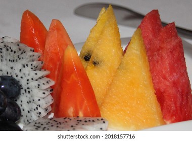 Colourful Tropical Fruit Platter Of Melon, Guava, Dragon Fruit And Grapes