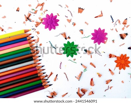 Colourfull Background With Pencil colours or pencil colours shavings and bright flowers