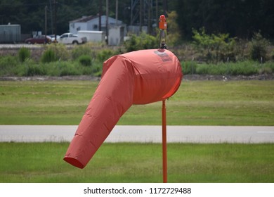 Columbia, SC/ USA- August 29, 2018: A Windsock Bearing A Rendition Of The South Carolina State Flag (Crescent Moon And Palmetto Tree) Stands Near The Runway At Jim Hamilton - LB Owens Airport (CUB). 