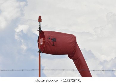 Columbia, SC/ USA- August 29, 2018: A Windsock Bearing A Rendition Of The South Carolina State Flag (Crescent Moon And Palmetto Tree) Stands Near The Runway At Jim Hamilton - LB Owens Airport (CUB). 