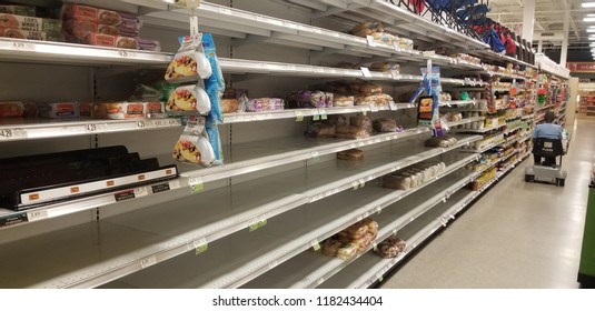 Columbia, South Carolina / USA - 09/15/2018: Grocery Store Bread Aisle Empty During Hurricane With Man On Motor Scooter