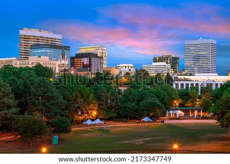 Columbia, South Carolina, USA downtown city skyline from Finlay Park at dusk.