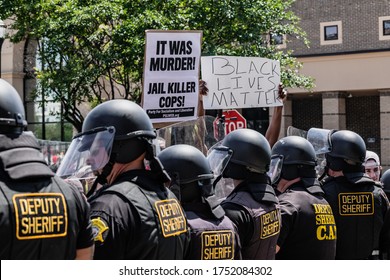 Columbia, South Carolina - USA - May 30, 2020: South Carolina protesters confront law enforcement at the Columbia Police Department in protest of the death of George Floyd.