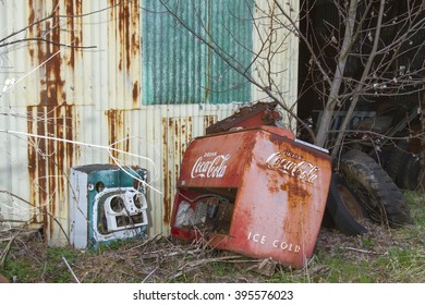 Columbia, VA, USA - March 12, 2016:  Antique Coca Cola Vending Machine Outside Metal Shed.