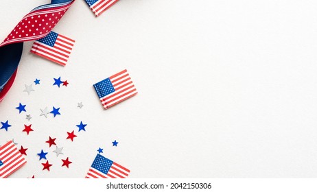 Columbus Day card, poster, background. Flat lay composition with United states decorations and ribbon on white background. - Powered by Shutterstock