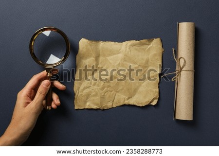 Columbus Day. Magnifying glass with an old sheet of paper