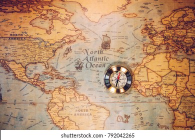 Columbus day and world map with compass