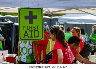 Columbus, OH USA 08-07-2021: First Aid Tent Located At A Parking Lot During A Sports Event. Medical Personnel Including Volunteers Are Waiting Under The Shade To Attend Minor Injuries Of Athletes.