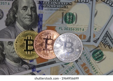 Columbus Ohio April 5, 2021
Bitcoin crypto currency with one hundred dollar bills US currency.