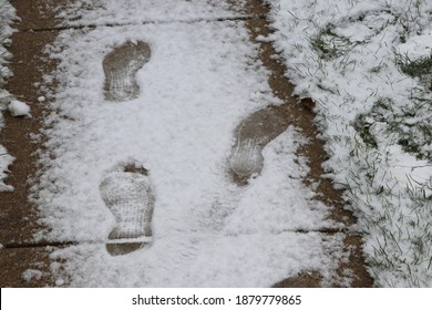 Columbus Ohio December 16, 2020
Footprints On A Snow Covered Sidewalk.