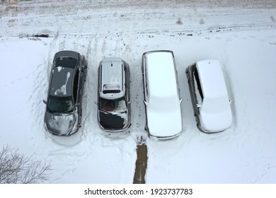 Columbus, Ohio February 19, 2021
Snowfall In A Midwest Residential Neighborhood With Snow Covered Vehicles.