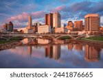 Columbus, Ohio, USA. Cityscape image of Columbus , Ohio, USA downtown skyline with the reflection of the city in the Scioto River at spring sunset.