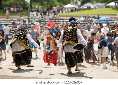 Columbus, Ohio, USA - May 27, 2018  A group of Bhangra dancers perform at the Asian Festival and the public join them in the dancing.