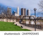 Columbus Ohio waterfront view of the downtown financial district from the River Scioto through a railroad truss bridge