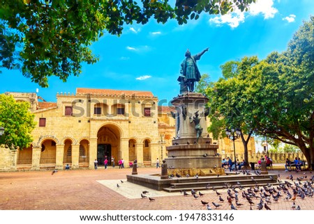 Columbus statue and Basilica Cathedral of Santa Maria la Menor in Santo Domingo Colonial zone. Parque Colon.