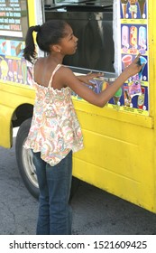 Columbus,Ohio July 12,2017: Young Teenage Girl Selecting Items Form Local Neighborhood Ice Cream Truck.