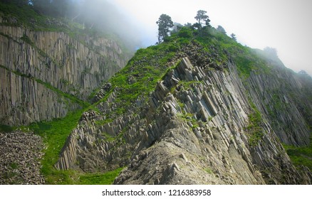 Column basalts formation of Stolbchaty cape at Kunashir at kuril islands, Russia - Shutterstock ID 1216383958