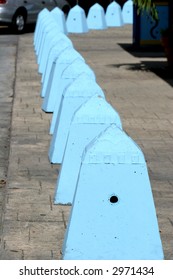 Column of blue posts running into the distance