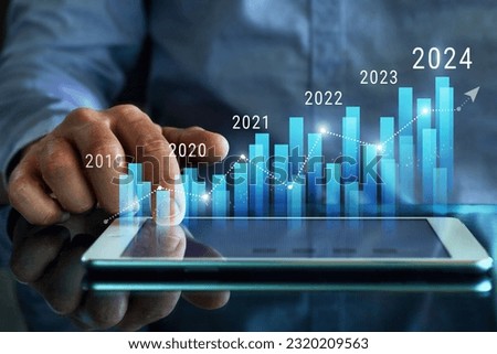 Column chart with company progress and growth by year, 2024, businessman calculates financial data for long term investments.