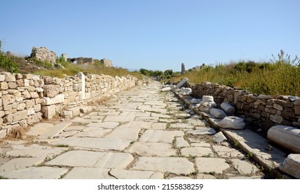 Column street. Harbor Street. Side. Turkey. Ruins of an ancient street. Column Street began behind a monumental arch, ran in a southwesterly direction and ended near the temples of Athena and Apollo - Shutterstock ID 2155838259
