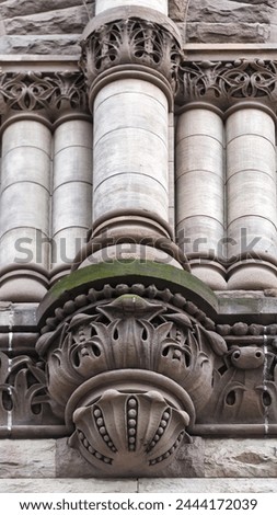 Column support structure with decoration. Colonial architectural feature or detail in Old City Hall Building (1898), Toronto, Canada