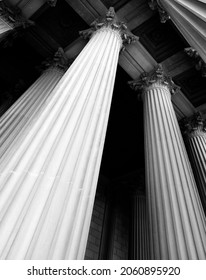 Columns on museum or courthouse building representing strength and support - Shutterstock ID 2060895920