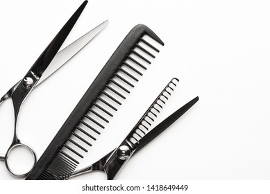 Comb And Hair Cutting Shears, Two Pair Texturizing Or Thinning Scissors For Haircut, Professional Salon Equipment. Copy Space, Flat Lay 