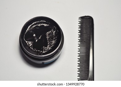 Comb And Pomade On White Background