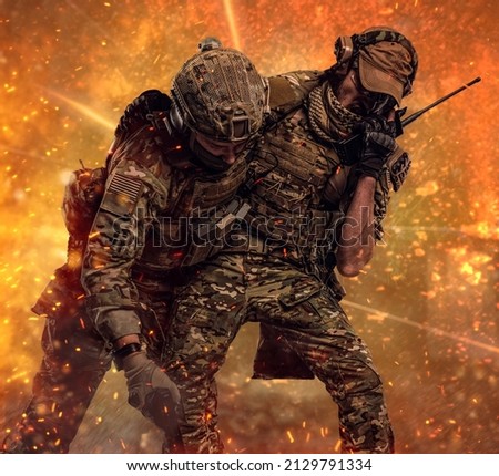 Combat conflict, special mission. The military soldier carrying teammate out of the battlefield. Studio photo against a dark wall